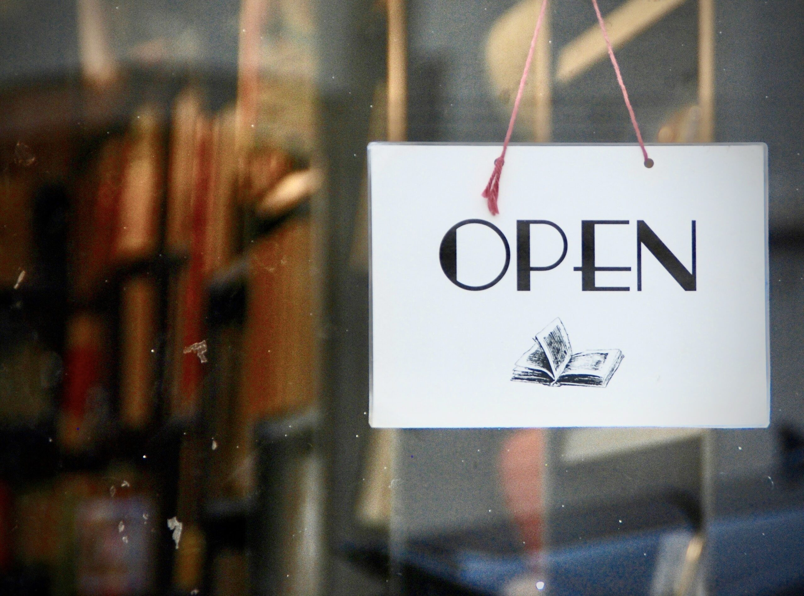 independent bookseller day - open sign on door of bookstore